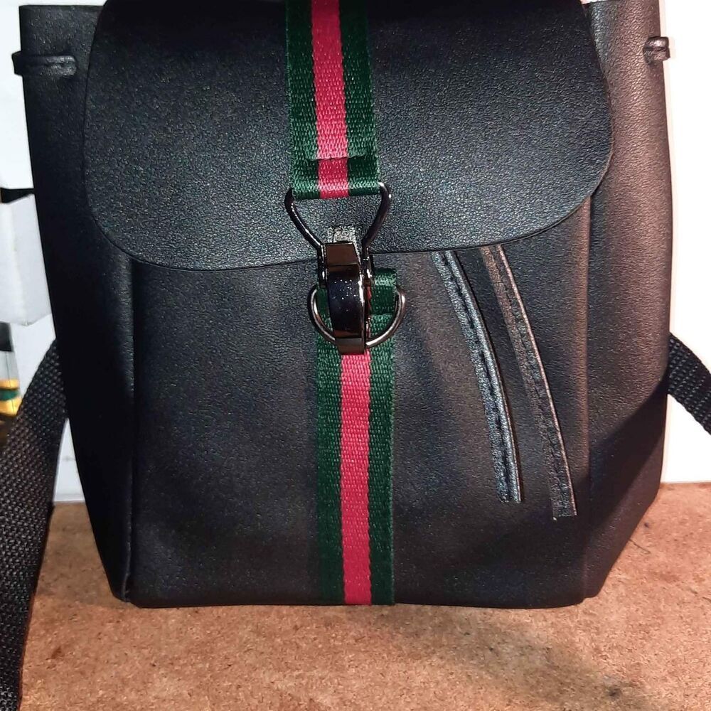 Fold Over Single Stripe Claw Closure Faux Leather Small Backpack Style Bag